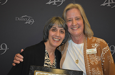  Dr. Lemmond congratulates Elaine Cunningham during Fantastic 49.